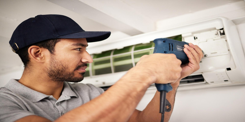 Professional technicians deal with stubborn clogs in the AC. 