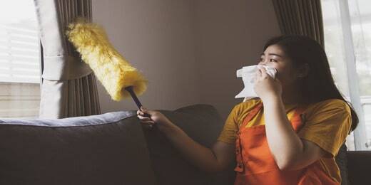 asian-woman-doing-housework-dusting-dirty-window-blinds-covering-her-nose-with-toilet-paper-allergy (1)-min