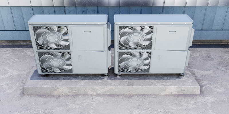 Commercial HVAC condenser units on a concrete base