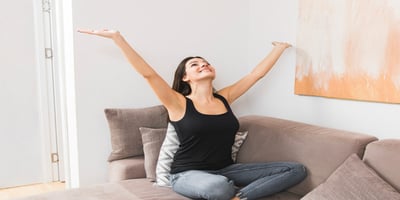Woman enjoying clean and healthy indoor air at home
