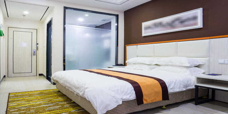 Modern hotel bedroom with integrated HVAC and zoning control