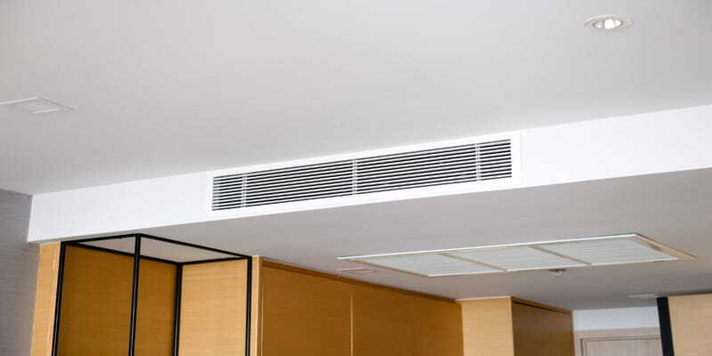 Ceiling-mounted air conditioning vent in a hotel suite 