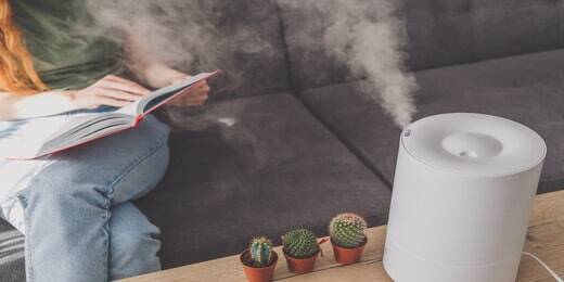 household-humidifier-home-table-near-woman-reading-sofa (1)-min