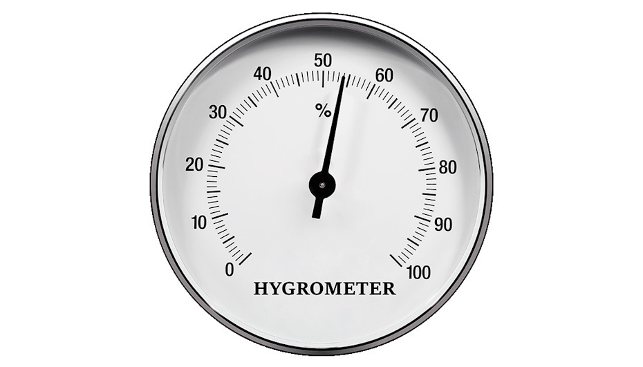 Analogue hygrometer showing around 50% humidity level for effective humidity control in house