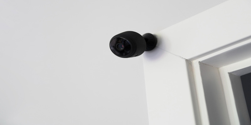 Indoor security camera mounted near door for Airbnb safety
