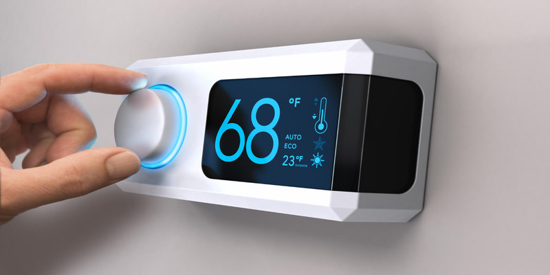 Modern smart thermostat with digital display and control dial