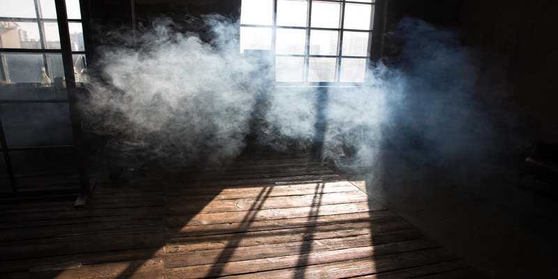 Smoky room with lingering cigarette smoke and odor indoors