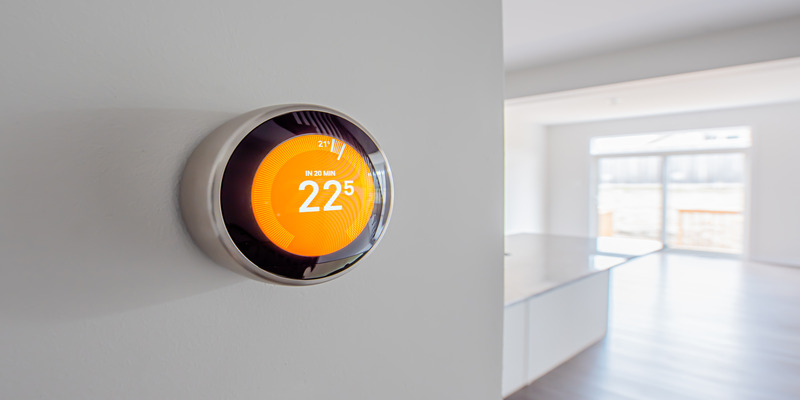 Modern digital programmable thermostat for controlling temperature in the home.