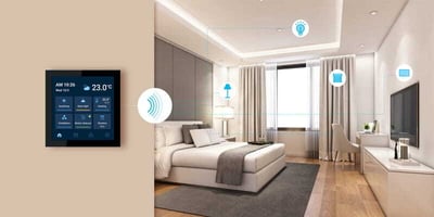 Smart HVAC thermostat in modern hotel room interior