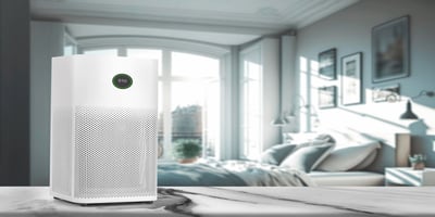 White air purifier in a bright bedroom near a large window