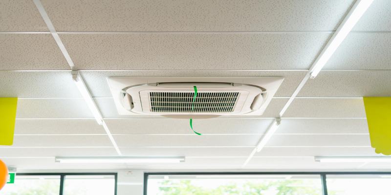 Ceiling cassette air conditioner installed in a school classroom for efficient cooling