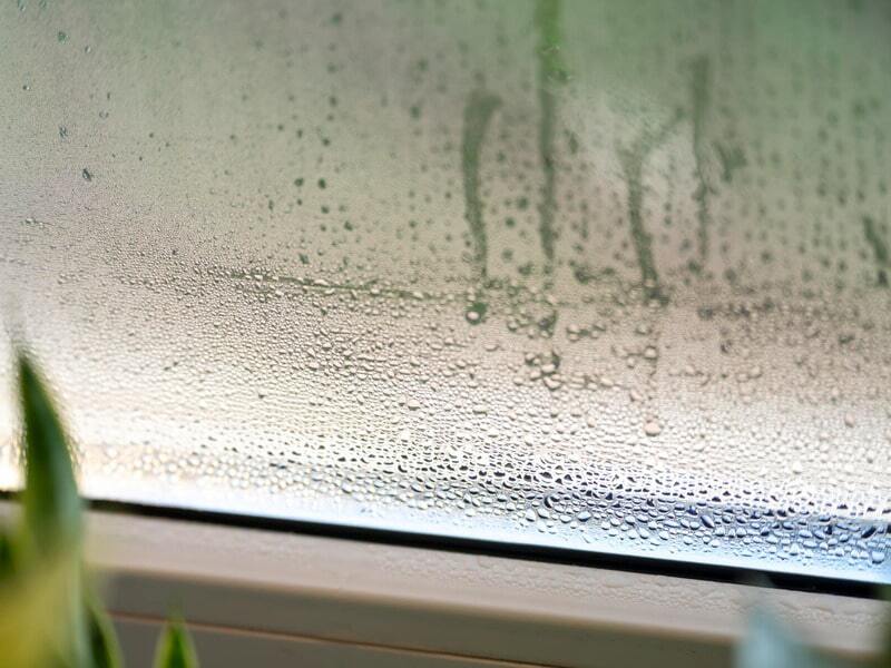 Window condensation caused by high humidity level showing why it is important to decrease humidity in house