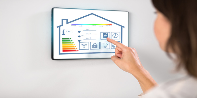 A woman controls a smart home thermostat via a tablet for effective temperature control.